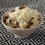 chanterelle seasoned rice in a pink rice bowl.