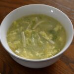 a bowl of corn and cabbage egg drop soup.