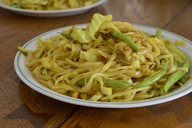 a steaming plate of turmeric yaki udon.