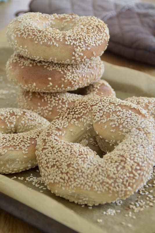 A stack of sesame seed bagels.