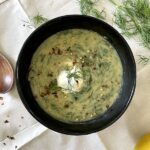 a bowl of lentil dill lemon soup