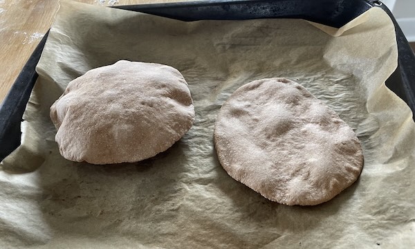 pita bread baked in the oven: one pita bread puffed while another did not.