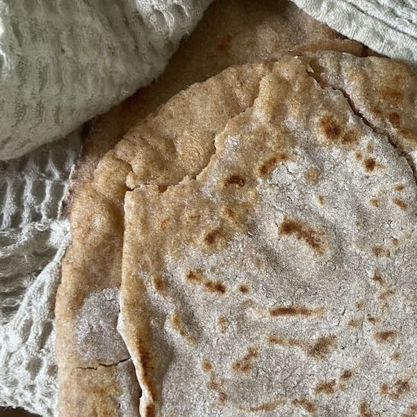 a cooked pita bread with too much oil at the edges.