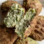 tofu balls made with egg. one tofu ball is split open to reveal texture.