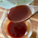 a close up of sweet and sour sauce