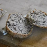 Seeded buns sliced open to show texture