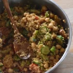 A big bowl of meal prepped high protein quinoa salad with sumac dressing.